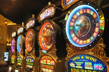 Live dealer at roulette table with multi-camera studio setup showing wheel close-up and dealer broadcast